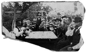[Group of men drinking outdoors]