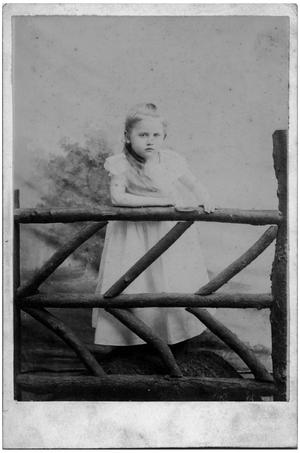[Young Girl by a Log Fence]