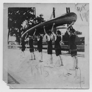 Primary view of object titled '[Six Men in Bathing Suits Carrying a Canoe]'.