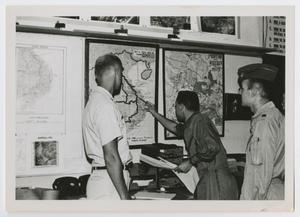 Primary view of [Men Looking at Map]