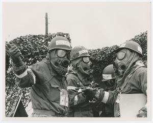 [Officers in Gas Masks]