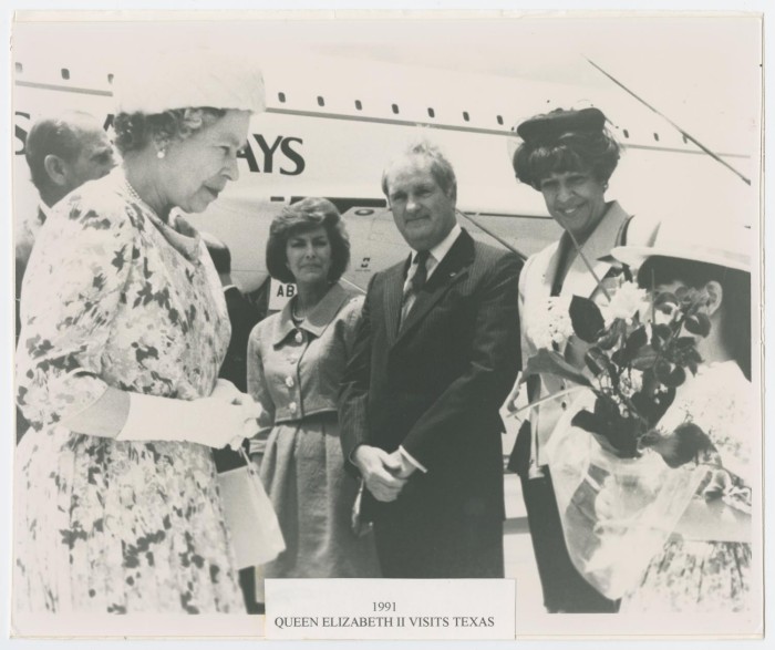 First side of: [Queen Elizabeth II Visiting Bergstrom], a photograph available in the The Portal to Texas History