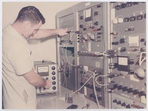 Primary view of [Man Testing Precision Instruments]