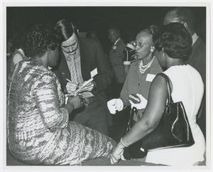 [Barbara Jordan Surrounded by Guests]
