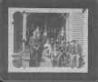 Primary view of [A group of young men and women posed on the steps of a house.]