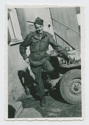Primary view of object titled '[Matt Scully Leaning on Jeep]'.