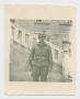 Photograph: [Soldier In Front of Stairs]