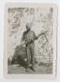 Photograph: [Homer Petross Holding a Captured MG42]