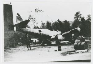 Primary view of object titled '[Soldier Next to German Jet]'.