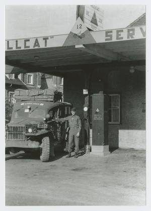 Primary view of object titled '[Soldier at Hellcat Service Station]'.