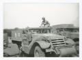 Thumbnail image of item number 1 in: '[Soldier Sitting on a Half-Track]'.