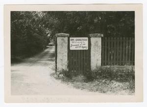 [Sign on Gate]