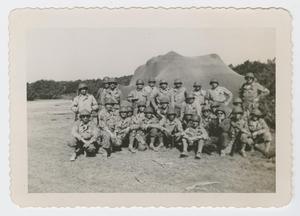 Primary view of object titled '[Men In Front of Camouflage Netting]'.