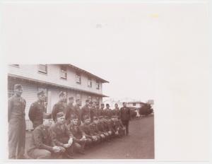 [Soldiers in Front of House]