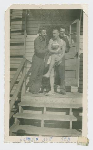 Primary view of object titled '[Three Men at Camp Barkeley]'.