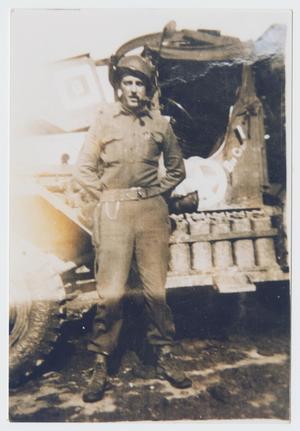 Primary view of object titled '[Phillip Frank In Front of Tank]'.