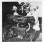 Photograph: [Kathryn Cass and friends in a red Maxwell car]