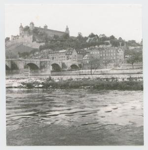 Primary view of object titled '[River View of Town Buildings]'.