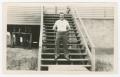 Photograph: [Andrew Jama Standing on Barracks Steps]