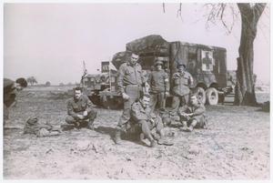 Primary view of object titled '[82nd Medical Battalion Soldiers with Ambulances]'.