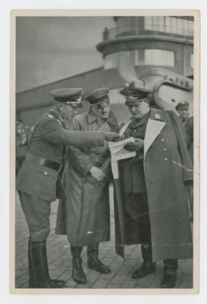 Primary view of object titled '[Hitler Looking at Papers]'.
