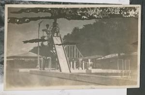 Primary view of object titled '[Men on Slide]'.