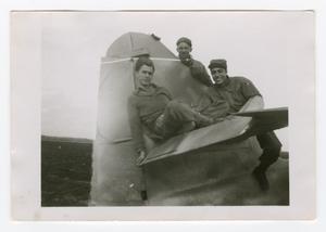 [Three Soldiers Posing on an Aircraft's Tailplane]