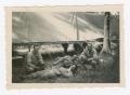 Photograph: [Soldiers Resting Outside Receiving Medical Station]