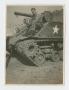 Photograph: [Soldier Sitting on Tank]