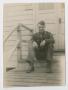 Thumbnail image of item number 1 in: '[Richard Olive Sitting Sitting on Barracks Steps]'.