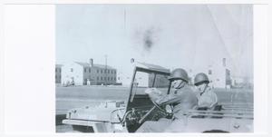 Primary view of object titled '[John Amundson and Passenger in a Jeep]'.