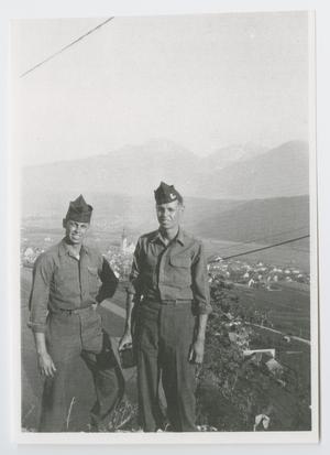 [Two Soldiers on Bluff Overlooking a Town]