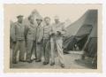 Photograph: [Five Soldiers Standing Togehter in Front of Tents]