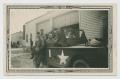 Primary view of [Six Soldiers Posing with Scout Car by Garage]