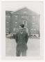 Photograph: [G. F. Loyd Standing in Front of a Three-Story Building]
