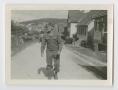 Thumbnail image of item number 1 in: '[Edward Siravo Walking Along a Village Street]'.