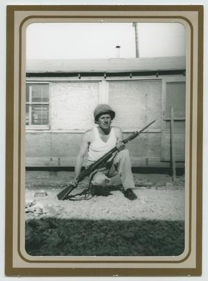 Primary view of object titled '[Private Ludwick Holding Rifle]'.