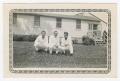 Thumbnail image of item number 1 in: '[R. Natopi, Dan Melli, and Johns Crouching Near Student Quarters at Camp Barkeley]'.