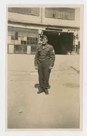 Primary view of object titled '[Soldier in Front of Building]'.