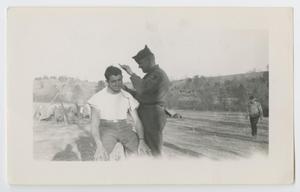 [Two Soldiers Engaging in a Hair Cut]