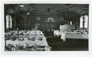 [Tables Set for Christmas Dinner in the 82nd Medical Battalion's Headquarters]