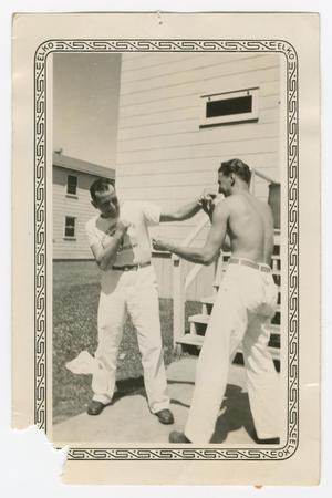 Primary view of object titled '[Winston and Dan Melli Fistfighting Playfully]'.
