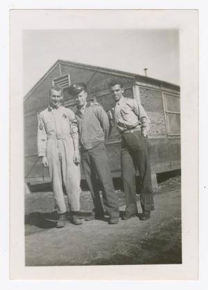 [Three Soldiers Standing in  Front of Hutment]