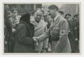 Primary view of [Adolf Hitler Speaking to a Couple]