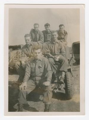 [Six Soldiers on the Front of a Jeep]