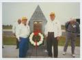 Photograph: [Mike Romano and Joe Mizer Standing by 12th Armored Division Memorial]