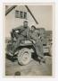 Primary view of [Franklin Frobisher and W. B. Cummings on a Jeep]