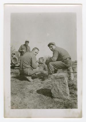 [Four Soldiers Gathered Among Stones]