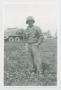 Photograph: [Soldier Standing in Field]