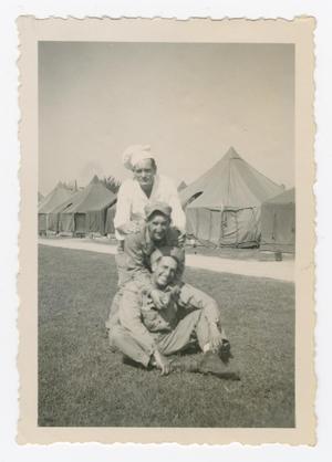 Primary view of object titled '[Geritza, Irving Denemark, and Dan Melli Posing Together on a Field]'.